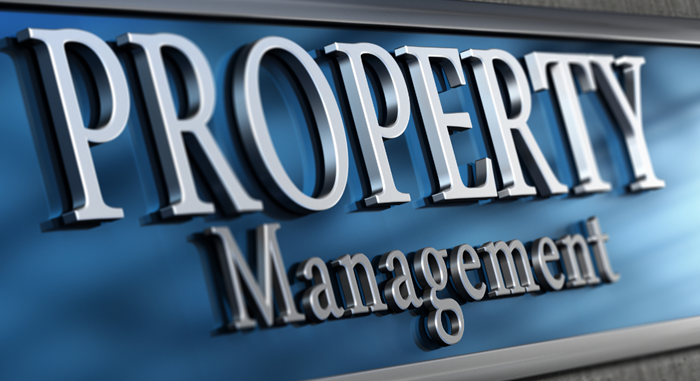 Silver 3d lettering on a blue sign reading "property management.