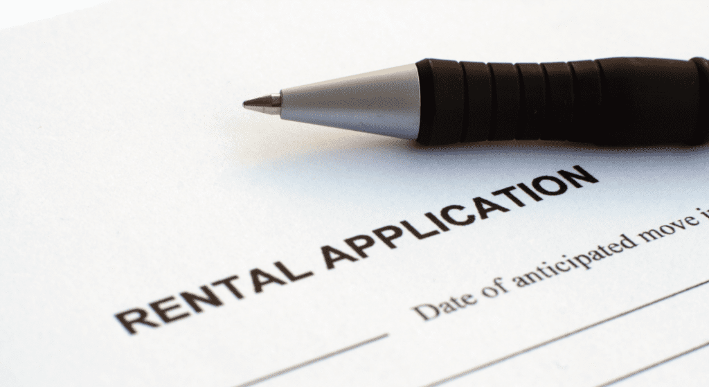 Rental Application document and pen