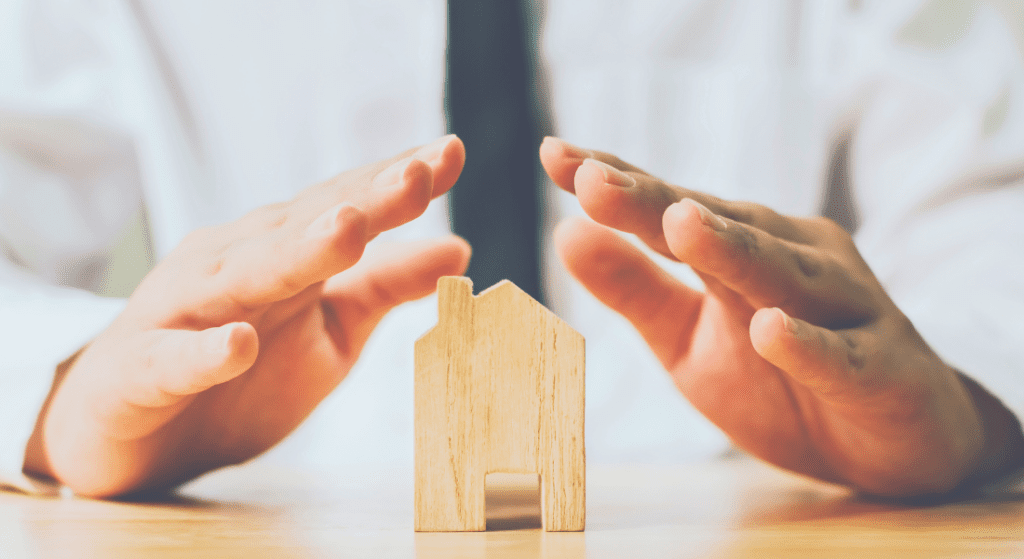 Sheltering house with hands