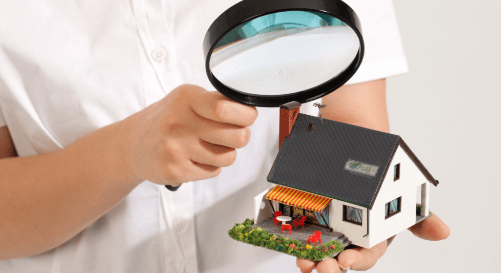 searching for house with magnifying glass